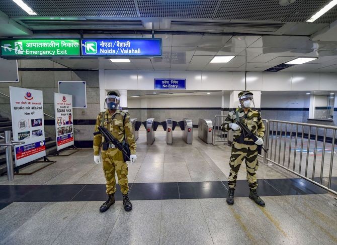 Security personnel stand guard at Rajiv Chowk station. Photograph: Manvender Vashist/PTI Photo